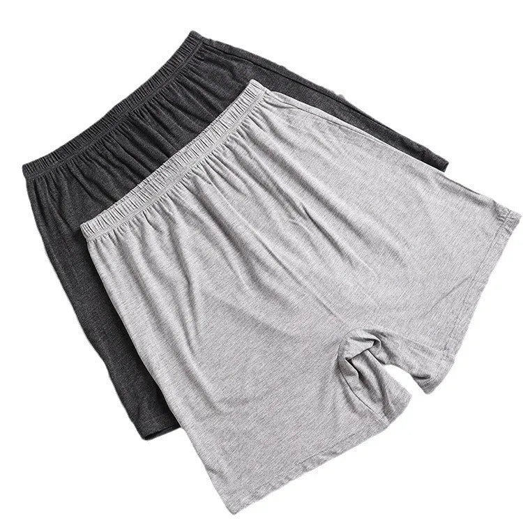 Men's solid colour high-waist boxers in modal fabric on size chart background