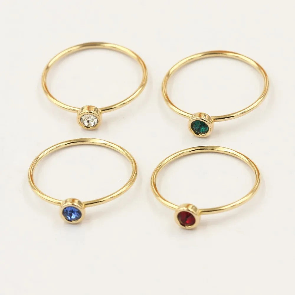 Women's copper knuckle ring with 14K gilded finish and colourful GF zircon stones.