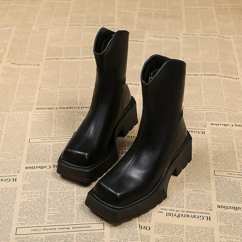 Black square toe platform Martin boots for women with a back zipper and mid-calf shaft.