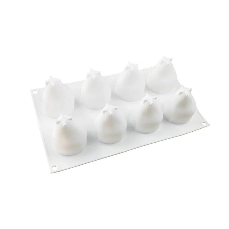 Silicone baking mould with six cavities shaped like pineapples, pine cones, and pears for making mousse desserts.