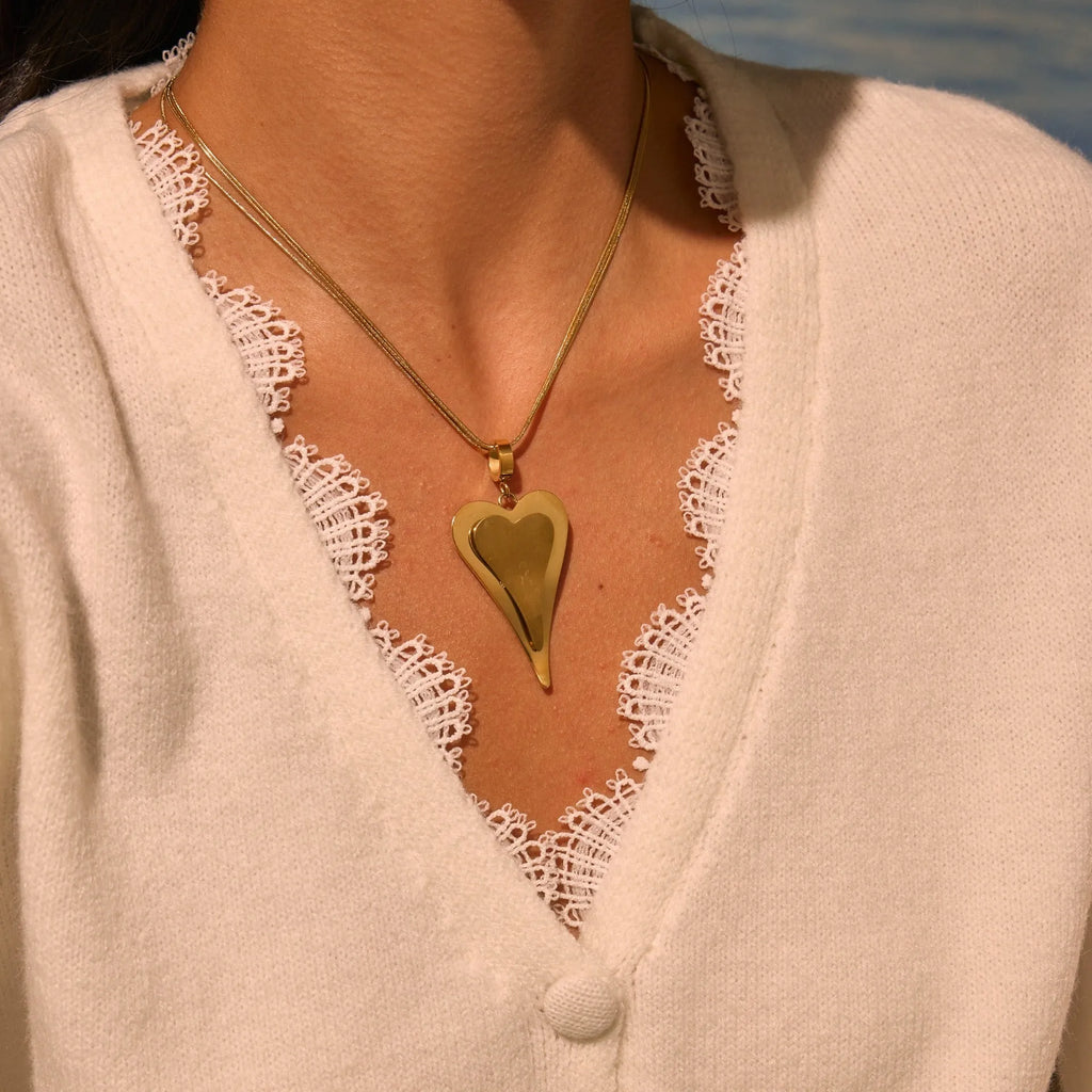 Geometric double-heart pendant on a stainless steel snake bones chain necklace for women, shown in gold and steel finishes.