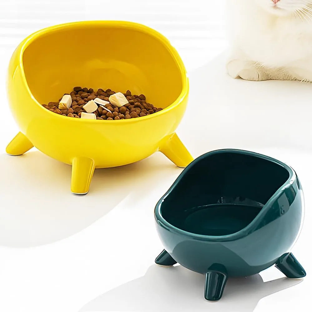Green ceramic pet bowl with four legs and wide opening for cat or small dog feeding