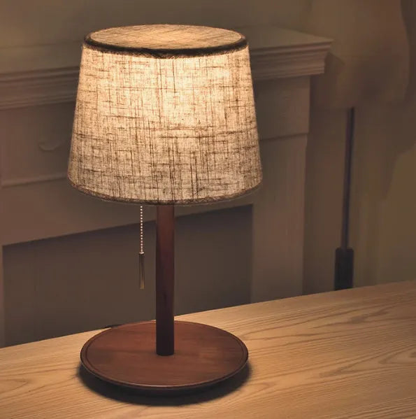 Walnut colour solid wood bedside lamp with cloth shade and cable switch