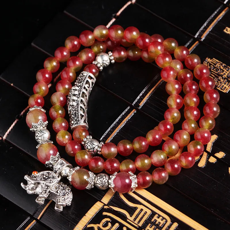 Handmade watermelon crystal bracelet with Chinese knot and elephant beads in 6mm or 8mm size.