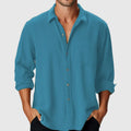Man wearing a loose fit pure colour casual shirt with a stand collar and long sleeves.
