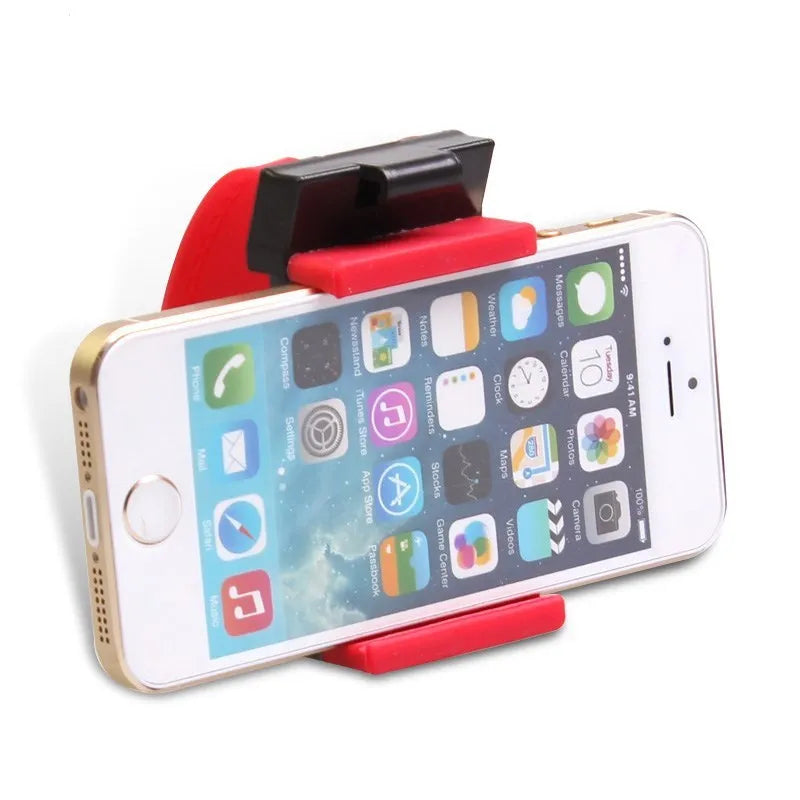 Black steering wheel phone holder mounted showing elastic clip and silicone phone padding