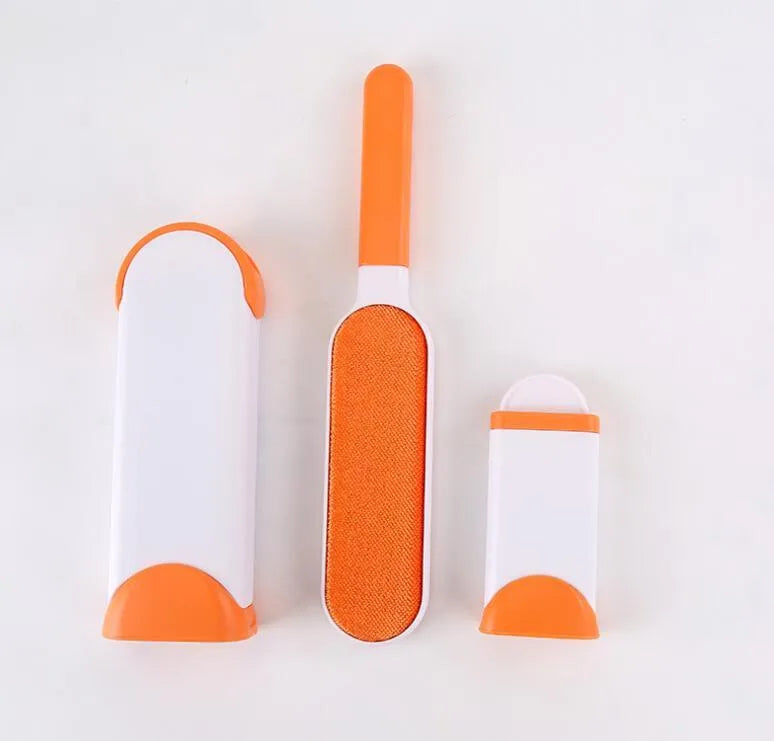 Blue reusable pet hair removal brush with double-sided sticky head placed on its self-cleaning base.
