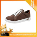 Men's black snake pattern leather low-top sneakers with round toe and flat rubber sole.