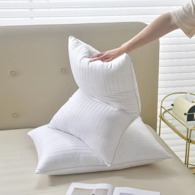 White cotton satin stripe pillow with feather and cotton filling, shown in low, medium, and high loft options.