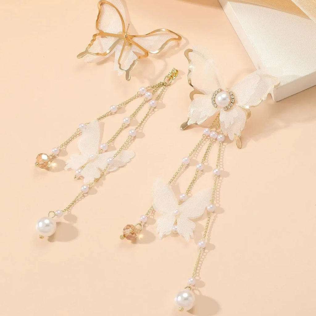 White butterfly earrings with tassel lace design featuring rhinestones and pearls