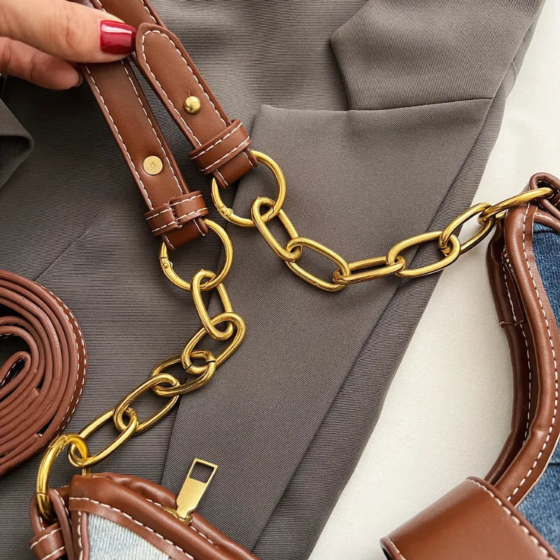 Brown denim women's shoulder bag with diamond mesh pattern and chain detail showing bucket shape