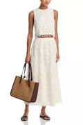 White women's two-piece suit set with embroidered sleeveless top and long skirt in retro style