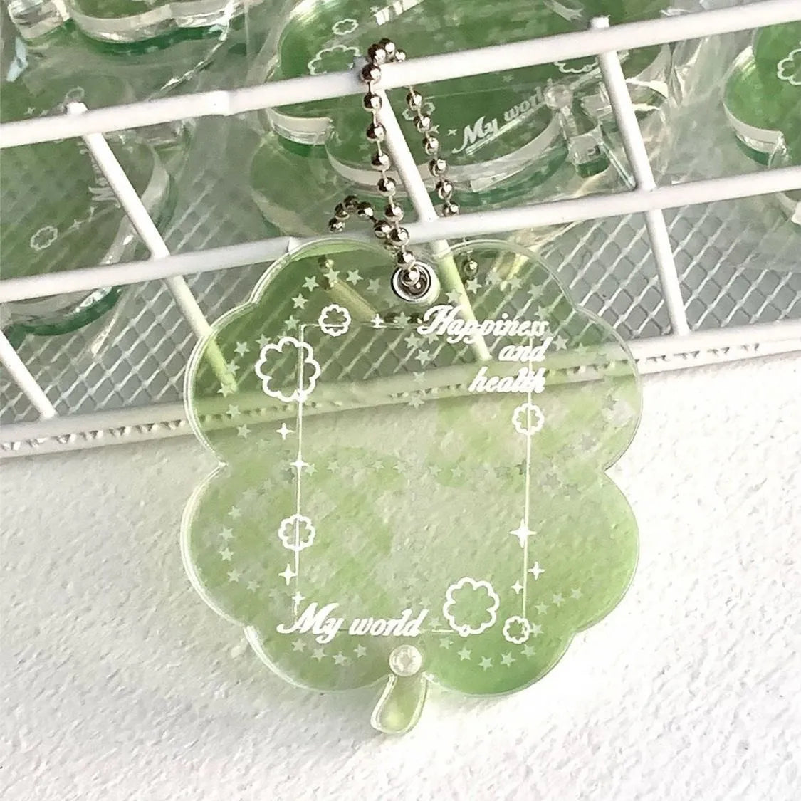 Acrylic four-leaf clover phone pendant in three colour variations