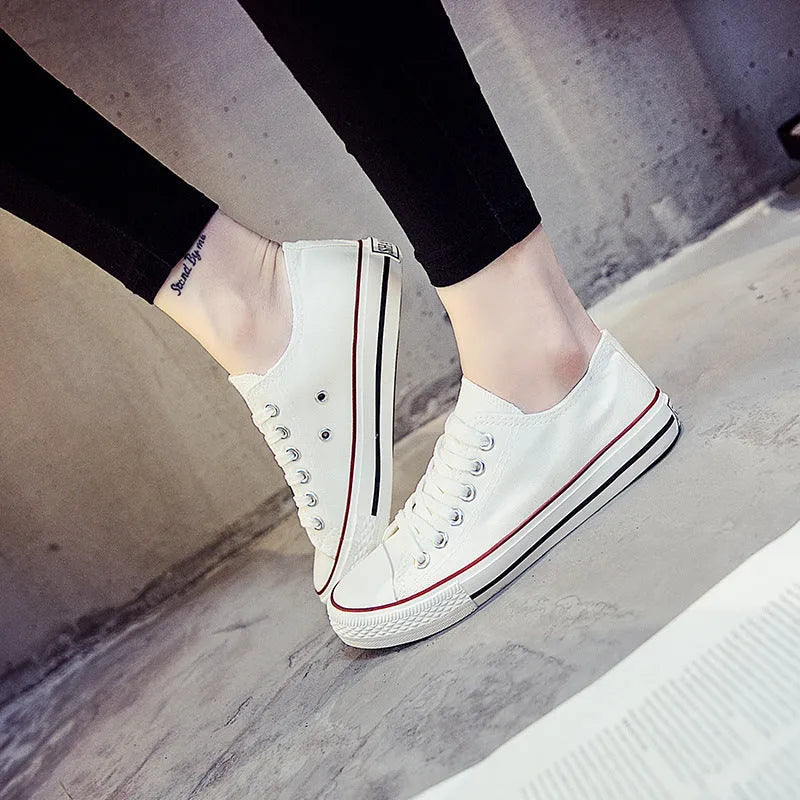 Women's solid colour canvas casual shoes in black, white black, white red, and all black.