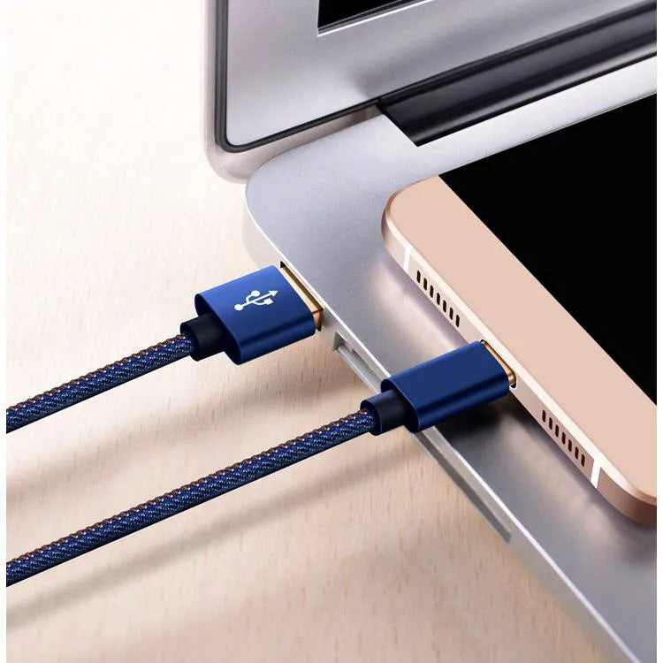 Close-up of a denim-braided USB-C cable with aluminium connectors in choice of colours.