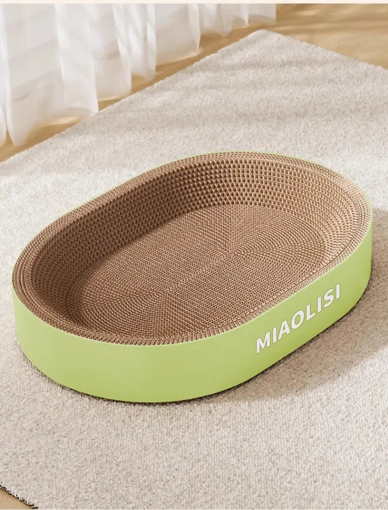 Green oval cat scratch board with built-in nest measuring 55cm in diameter
