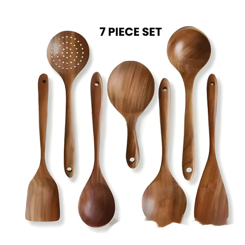 Seven-piece wooden spoon and spatula kitchen utensil set on kitchen counter