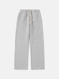 Man wearing grey fleece-lined sweatpants with a drawstring waistband