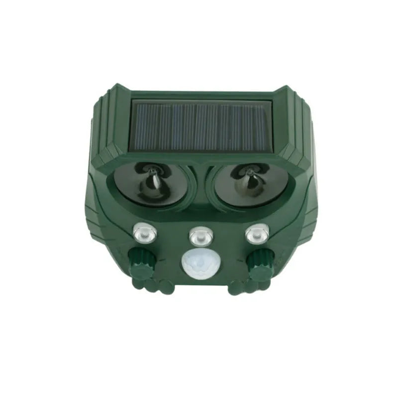 Green solar-powered ultrasonic animal repeller with dimensions 12x13x5cm