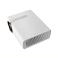 YG530 black and white mini portable LED projector with wireless mobile phone connectivity on a table.