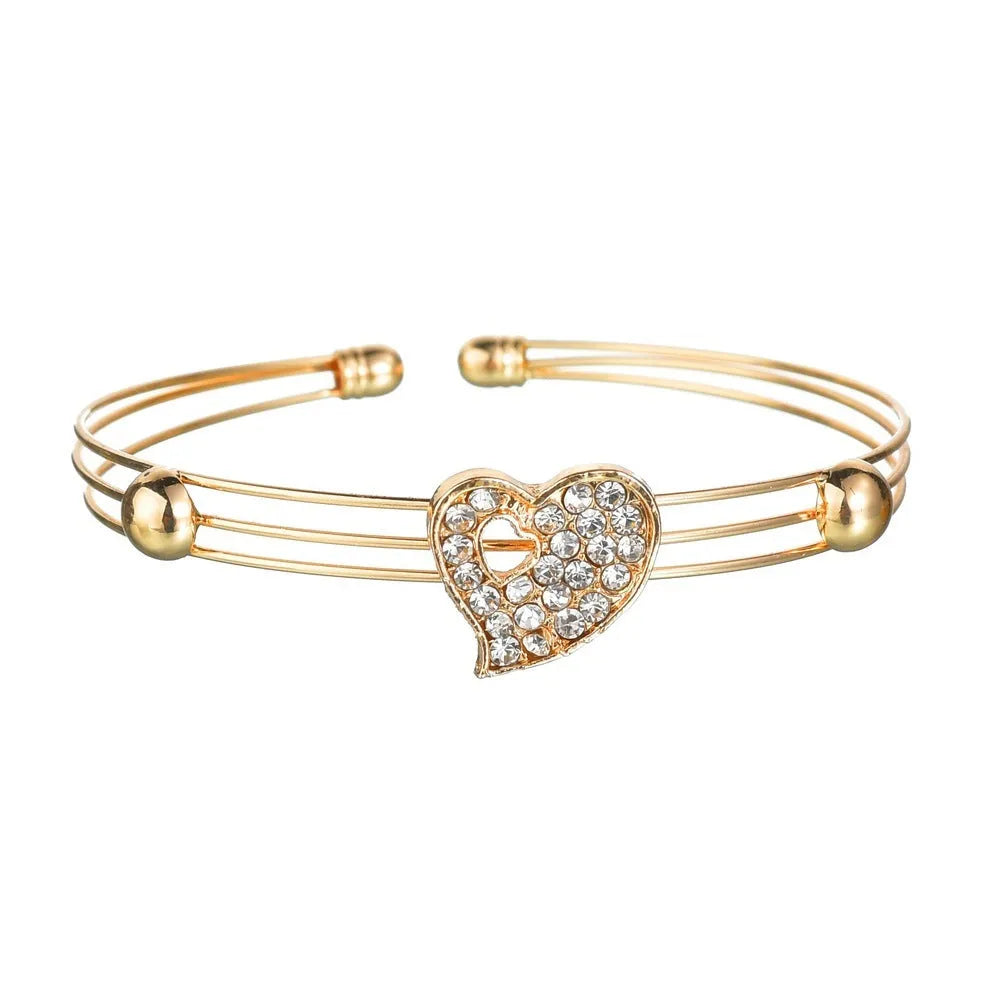 Gold tone love symbol jewellery set with earrings, pendant necklace and bracelet on 21-50cm adjustable chain