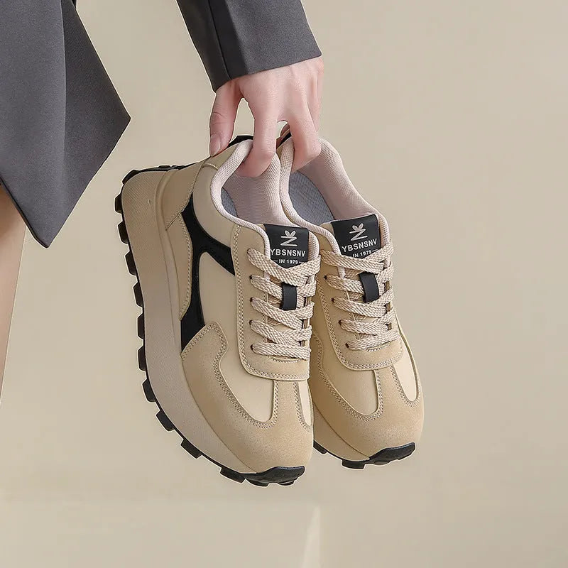 Women's casual platform sport shoes in solid colours with flat rubber sole and lace-up front.