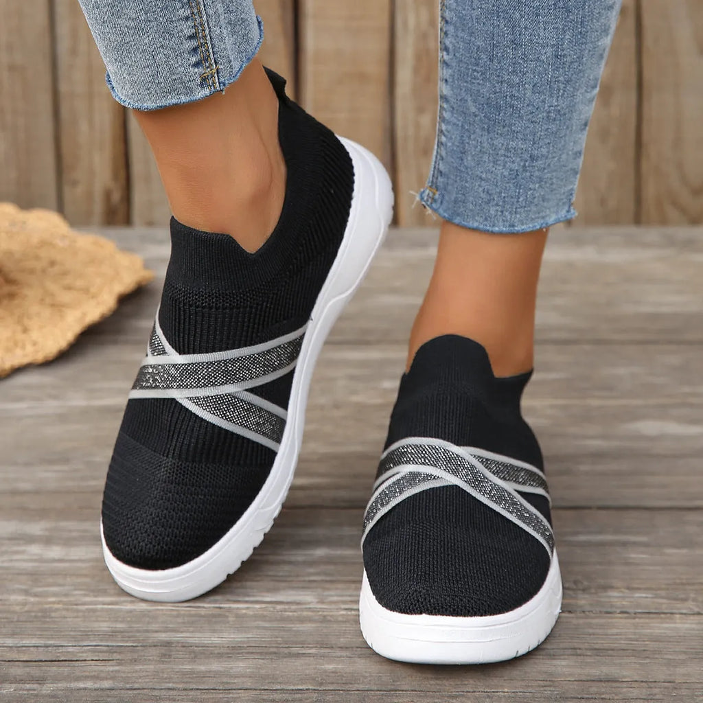 Black women's flyknit mesh casual shoes with flat rubber sole and tassel detail