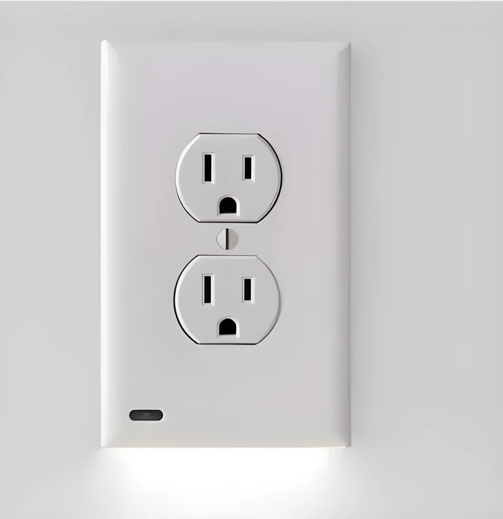 White socket induction LED night light plugged into UK wall socket with automatic sensor
