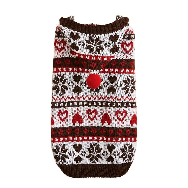 Colourful knitted dog sweater with snowflake and love heart patterns on a striped background.
