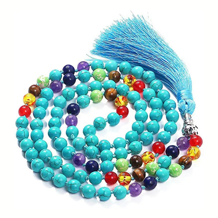 Geometric agate pendant necklace with colourful stone pattern and tassel detail on model