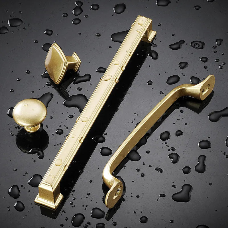 Gold T-shaped aluminium alloy cabinet handle showing single hole fitting, with size options for 96mm, 128mm, and 192mm hole distance.