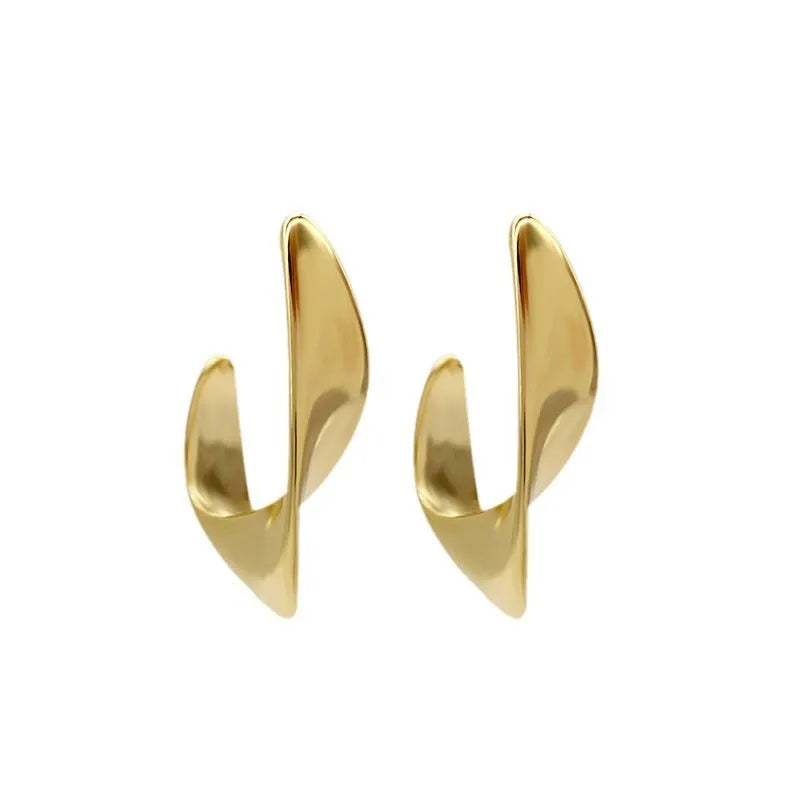 Metal twisted geometric earrings with round elements in gold or silver finish