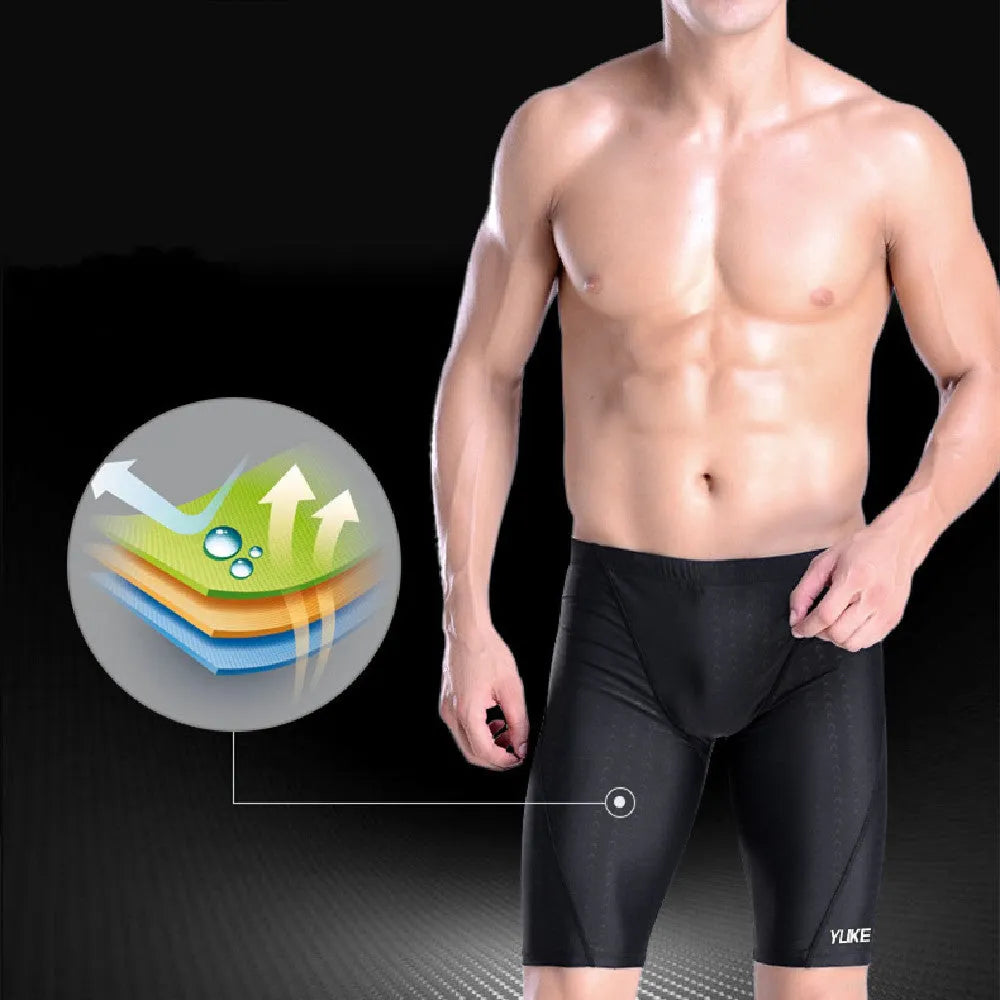 Men's black polyester swimming trunks set with anti-fog goggles, waterproof cap, ear plugs, nose clip, and carry bag.