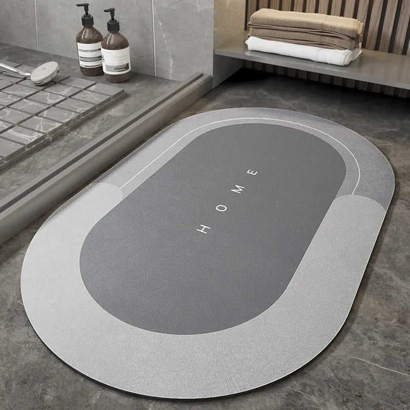 Blue oval blended fabric bathroom floor mat placed on tiled floor.