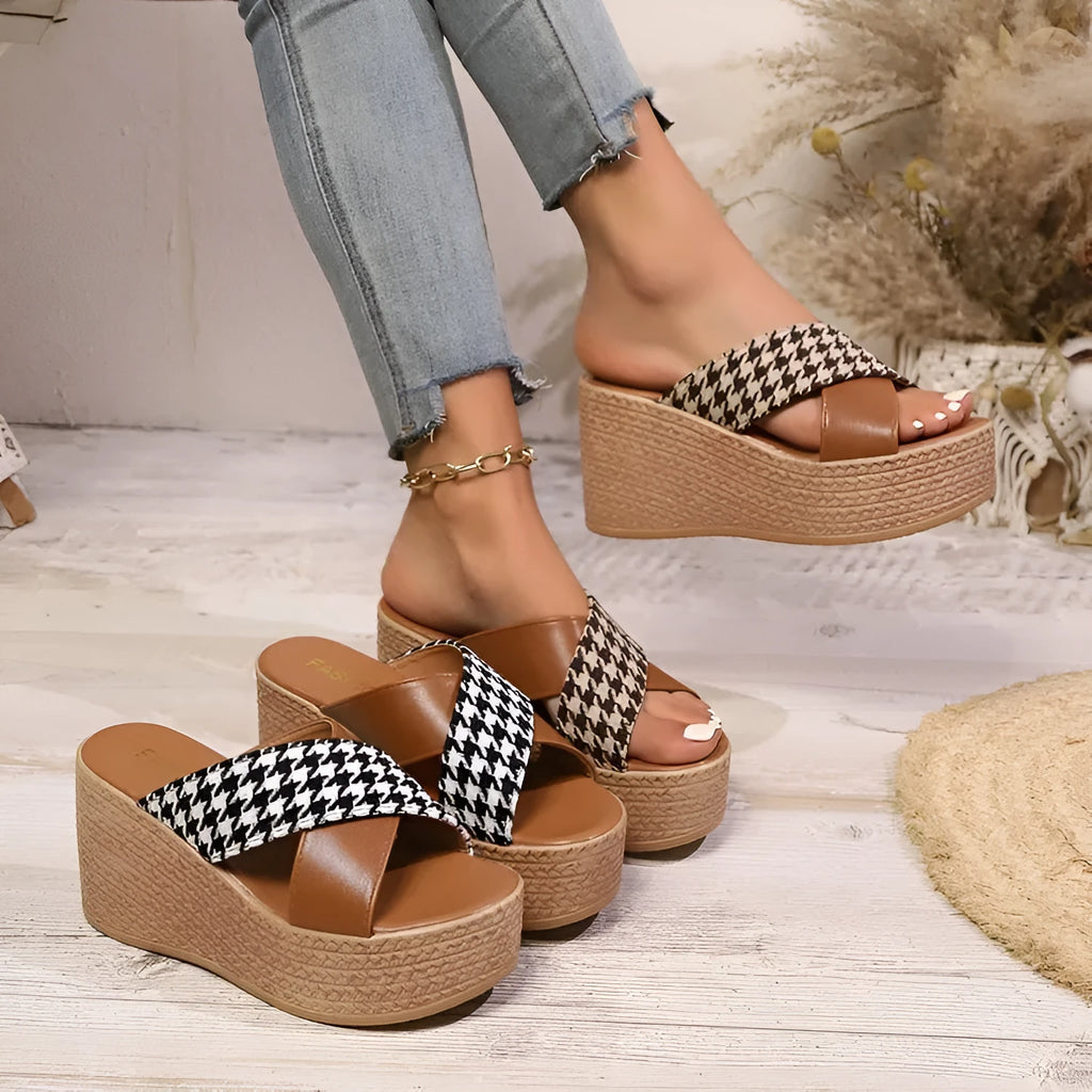 Brown plaid wedge sandals with cross leopard print and a black rubber sticky sole.