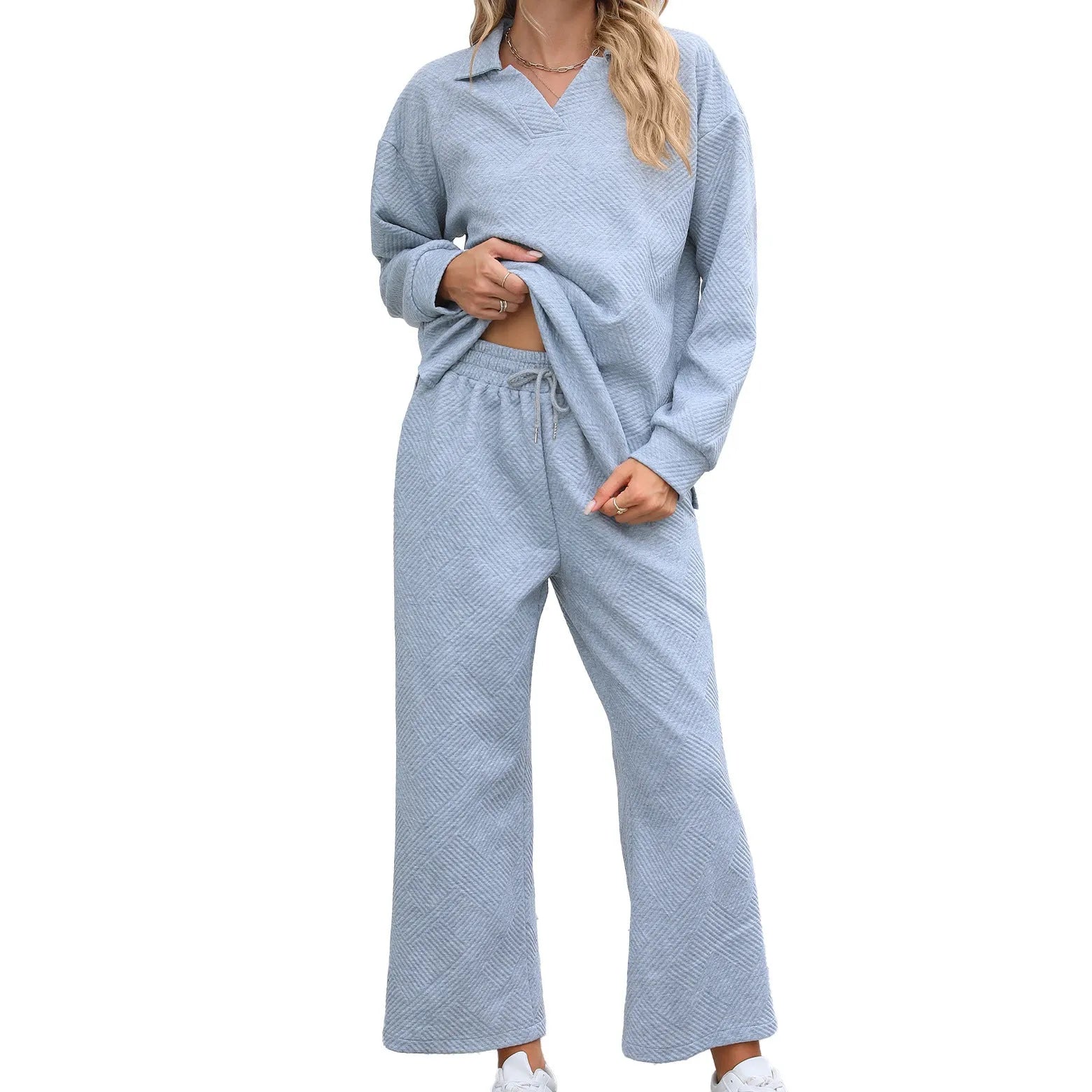 Women's solid colour knitted jacquard suit with lapel long sleeve top and elastic waist cropped pants.