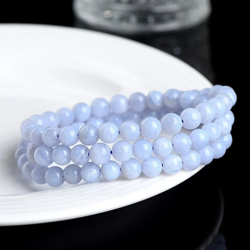 Close-up of a blue multi-circle patterned agate bead bracelet with 6-6.8mm beads and ruyi decorative elements.