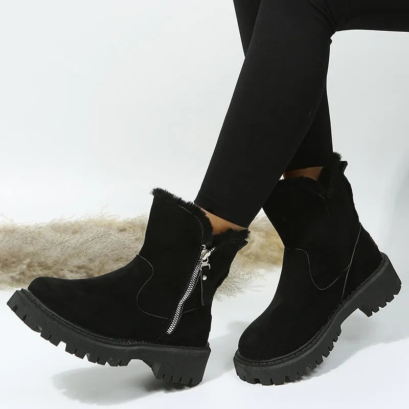 Women's black high-top plush snow boots with a side zipper and thick rubber sole