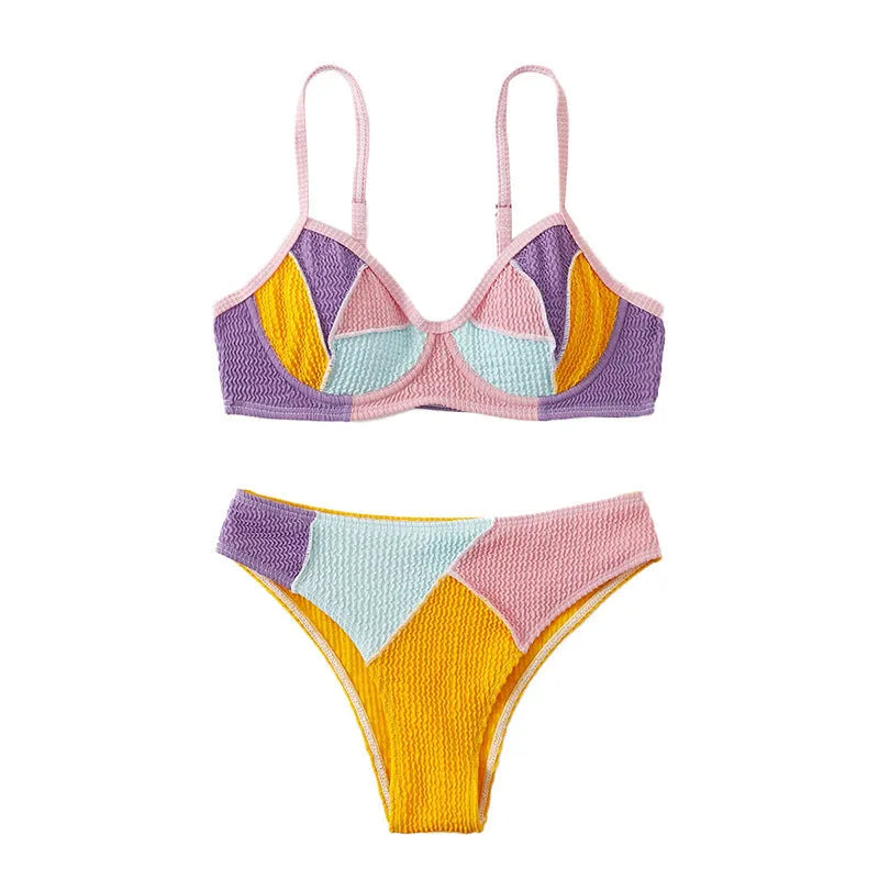 Women's spliced colour bikini set with steel push-up cups and matching shorts.