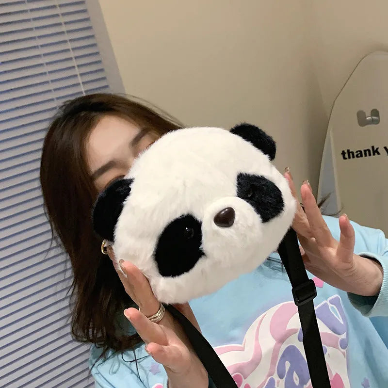 Plush panda head design crossbody bag showing cylindrical shape and sandwich pocket