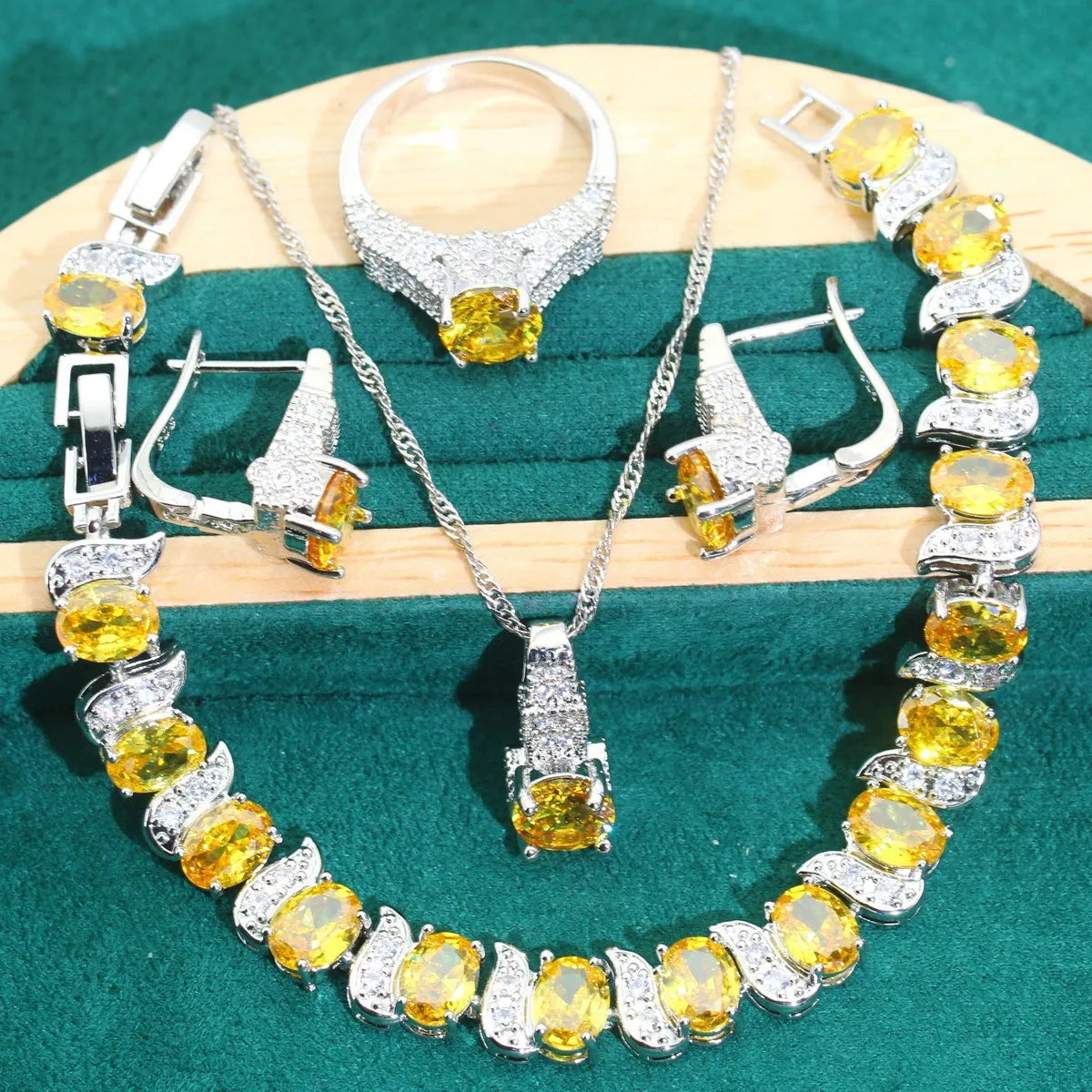 Bridal four-piece zircon jewellery set showing necklace, bracelet, earrings, and ring in alloy with water wave chain.