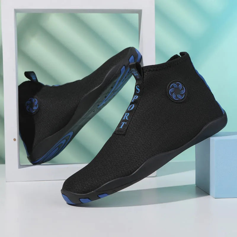 Casual mid-top outdoor beach shoes in black with coloured accents, showing mesh upper and rubber sole.