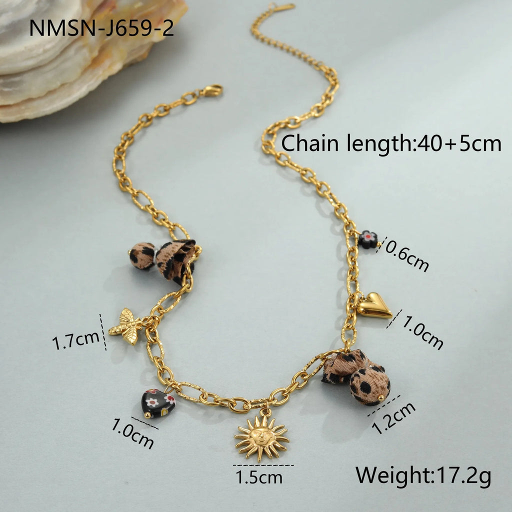 Stainless steel necklace with gold electroplated leopard pendant featuring love heart flowers on geometric design