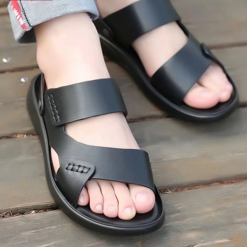 Men's brown and black waterproof plastic casual sandals on a beach background.