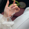 White sweet bow pearl necklace with geometric design on adjustable 31-40cm clavicle chain