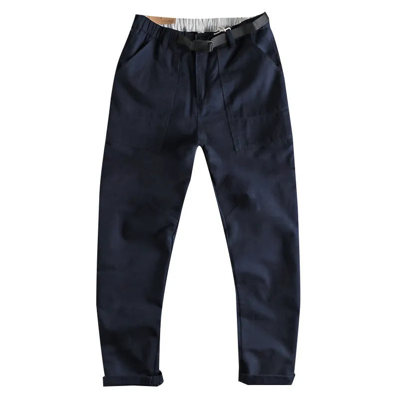 Men's cotton work trousers with N I buckle belt in dark blue colour showing three-dimensional cutting construction