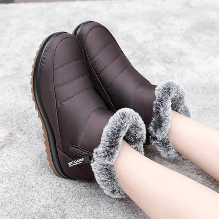 Women's winter ankle boot with side zipper and fleece lining, shown in black, dark brown, and red.