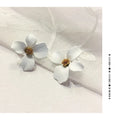Flower-shaped stud earrings for women in white and pink colour options