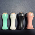 Volcanic stone facial roller for oily skin control in black, green, pink, or white colours