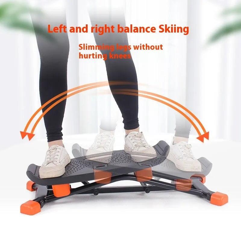 Black mini fitness skiing machine with elastic hand straps showing compact 77cm length design